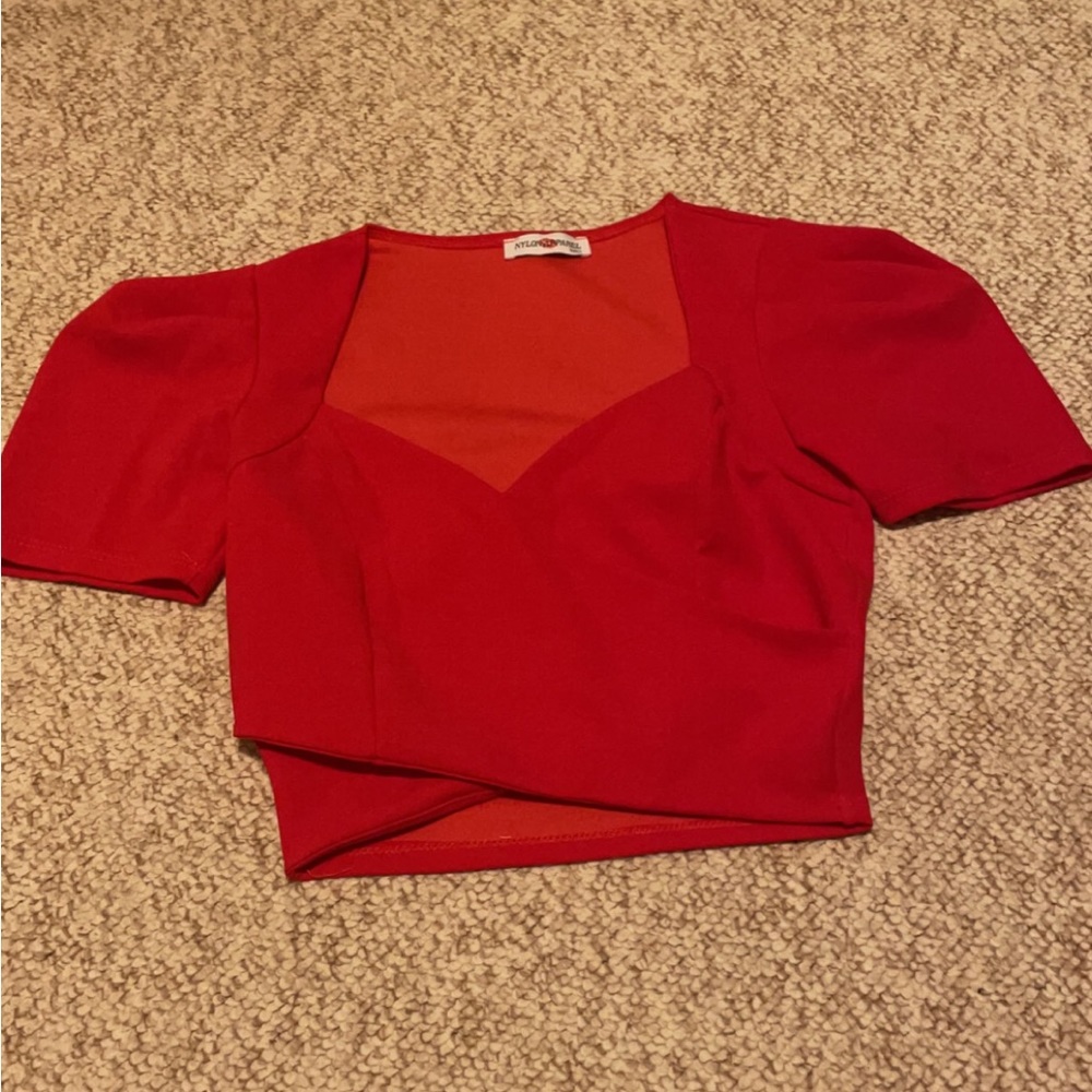 V neck short sleeve cross chest top, sleeves slightly puffed. never worn